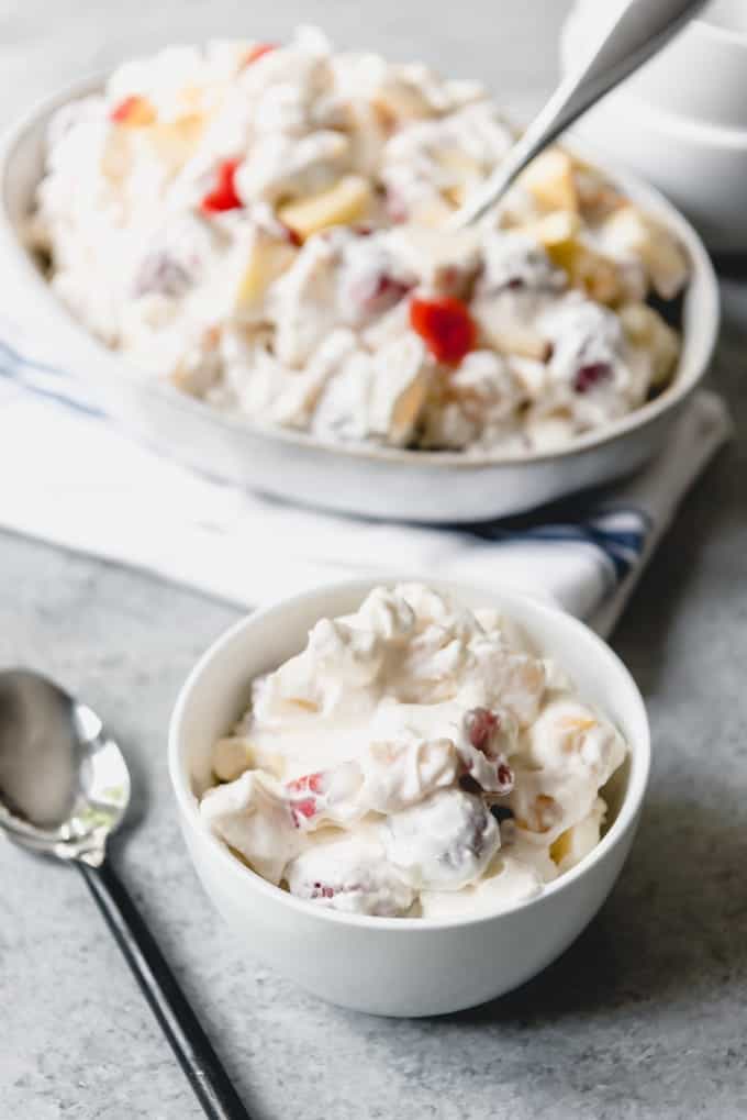 A bowl of creamy fruit salad with marshmallows makes a tasty and light, easy dessert.
