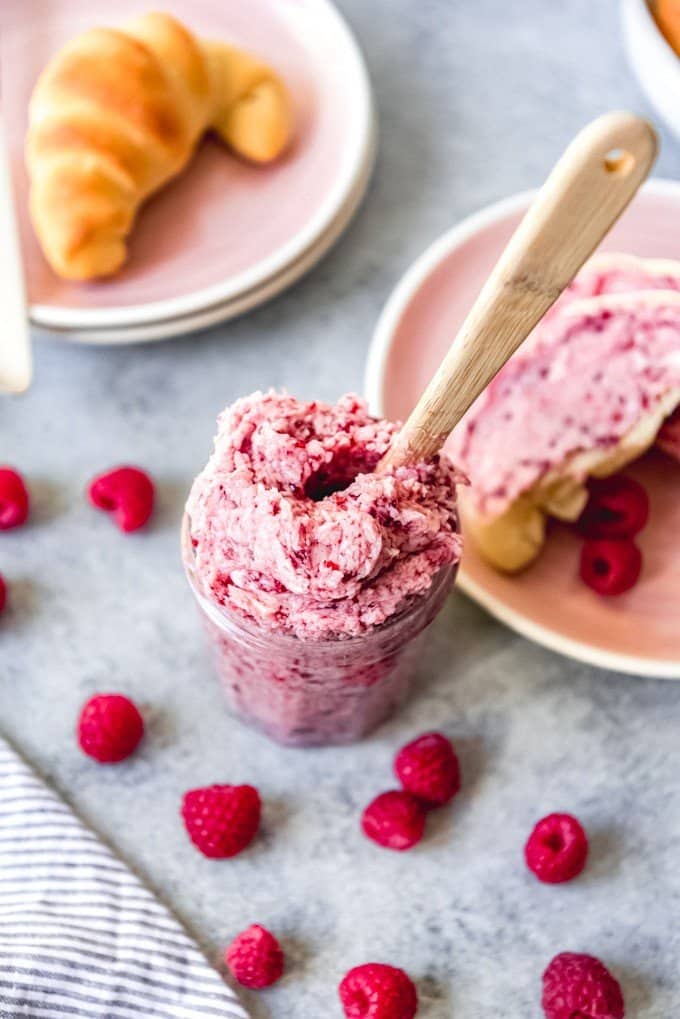 An image of whipped raspberry butter in a jar for spreading on rolls, muffins, scones, and more.