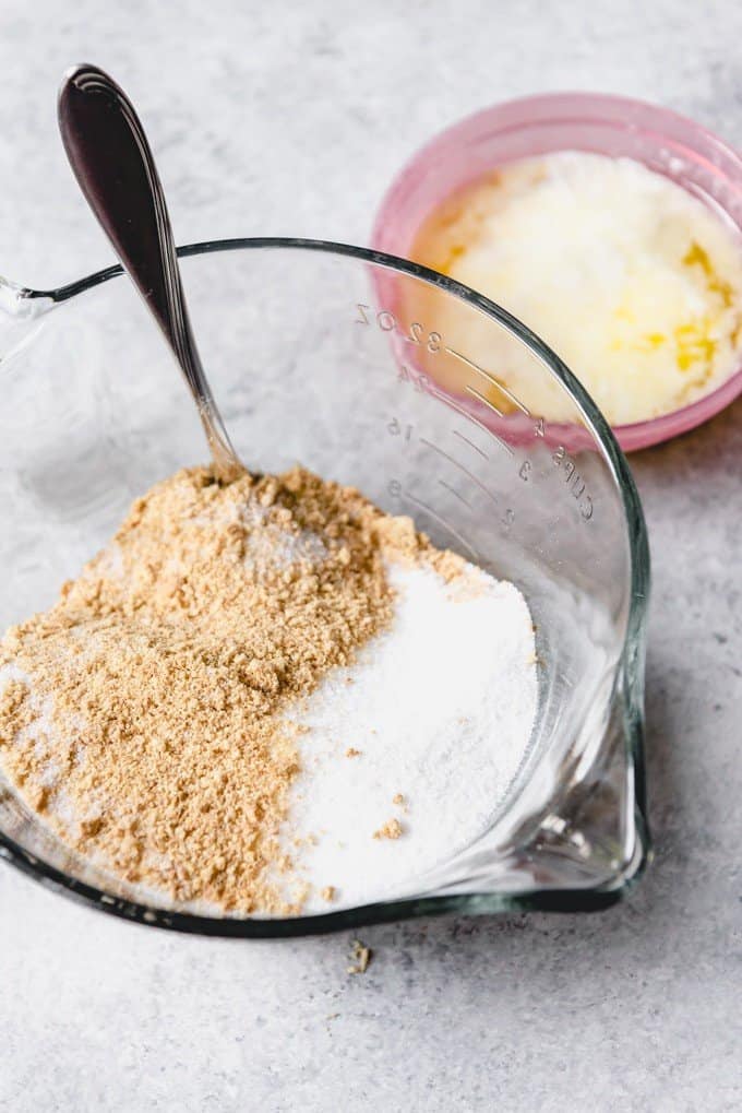 An image of graham cracker crumbs in a mixing bowl with sugar for making a graham cracker pie crust.