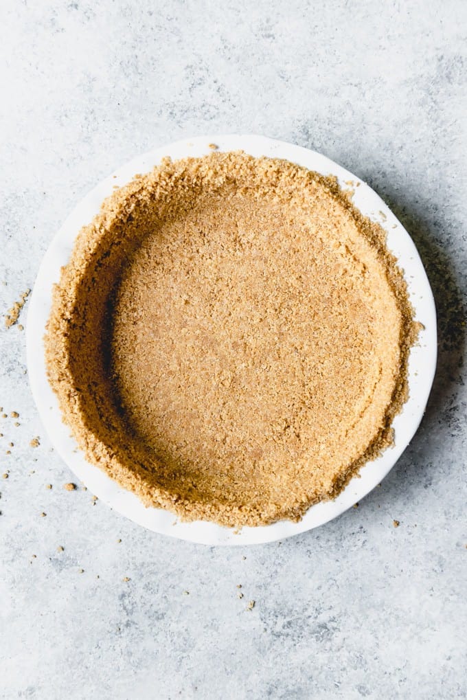 An image of a graham cracker pie crust for key lime pie.