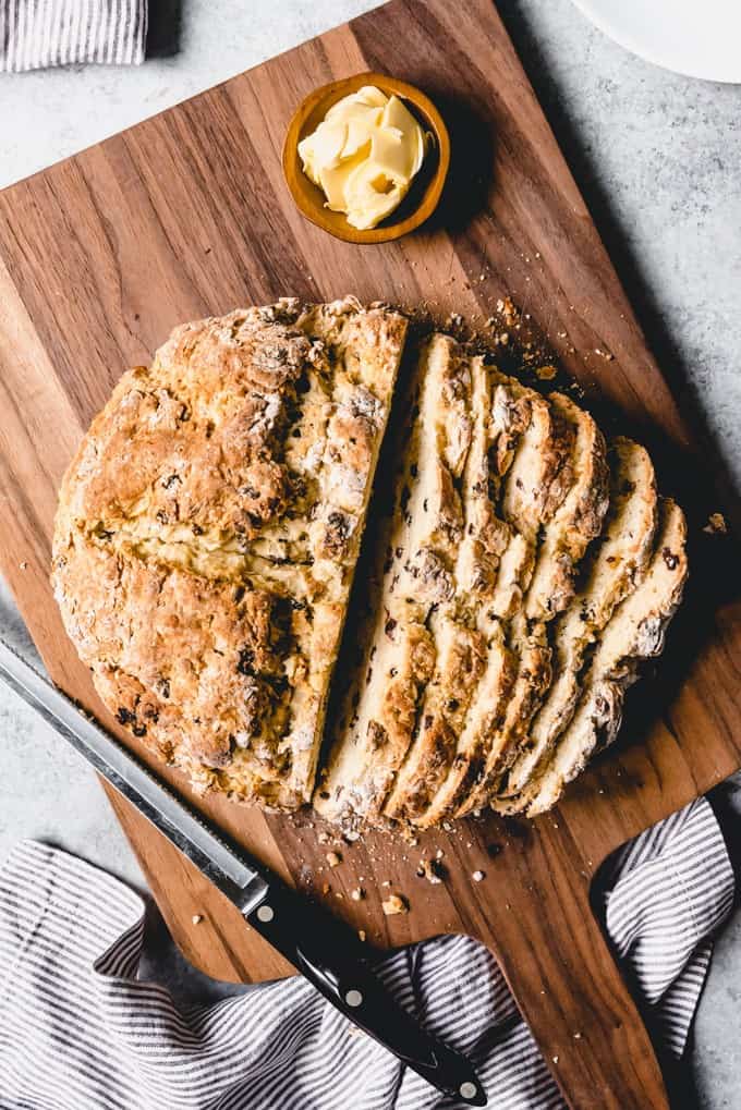 An image of a sliced loaf of traditional Irish soda bread recipe made with currants.