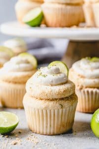 key lime cupcakes garnishes with crumbs and key lime slices