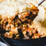 a close up view of a spoonful of sheperds pie