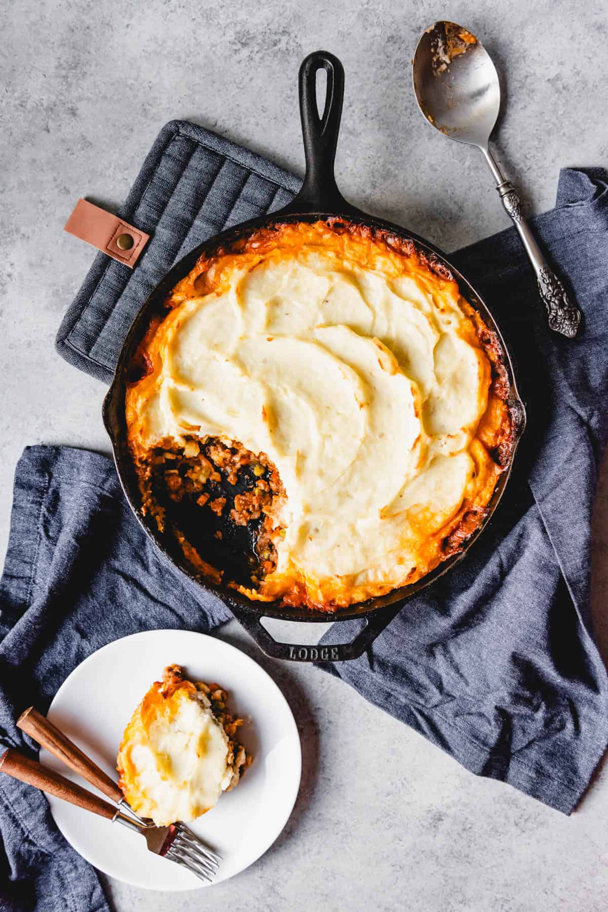 An image of classic shepherd's pie, a traditional Irish recipe, made with ground lamb, vegetables, a rich gravy, and creamy mashed potatoes on top.