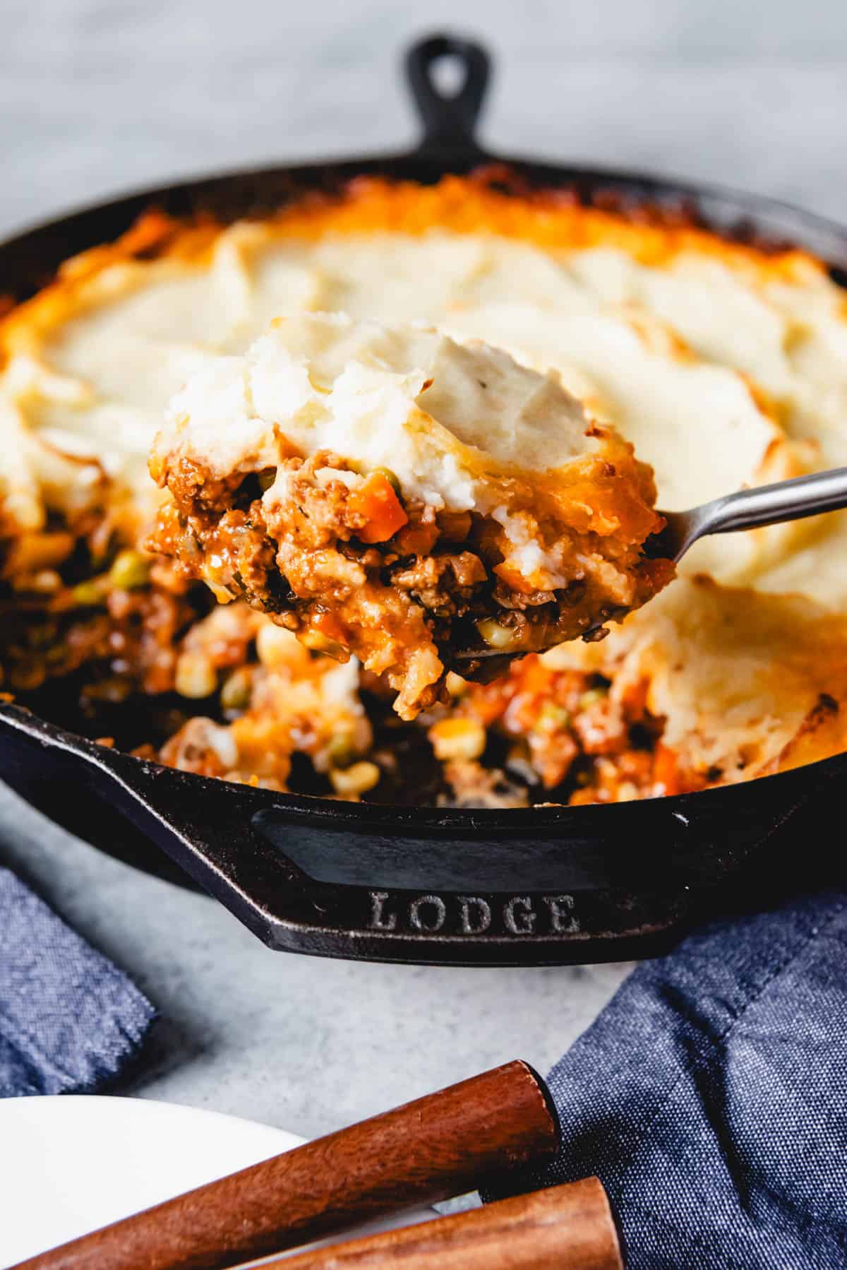 a close up view of a spoonful of sheperds pie