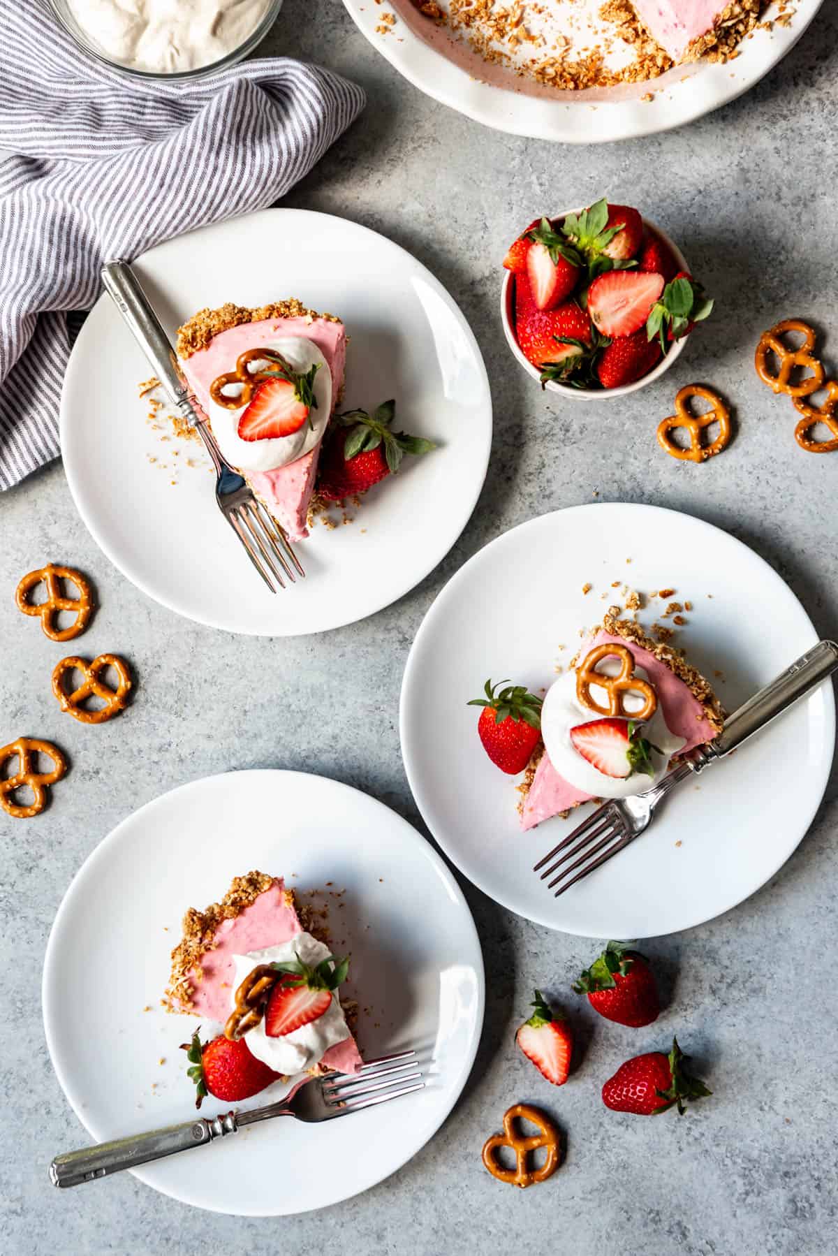 An overhead image of slices of strawberry pretzel icebox pie.