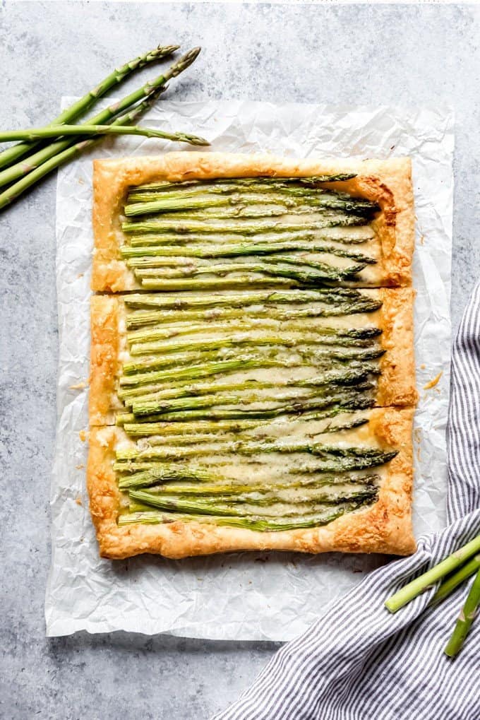 an aerial view of asparagus tart sliced into three parts