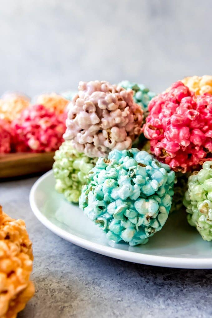 An image of colorful marshmallow popcorn balls made with Jello.