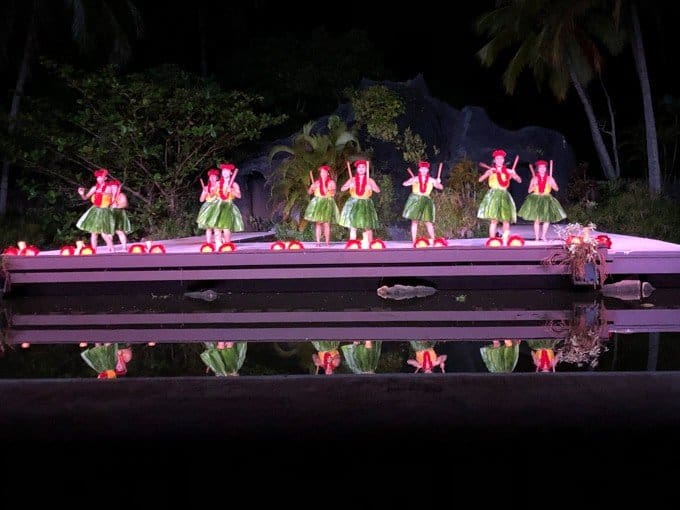 a live show of women in grass skirts dancing