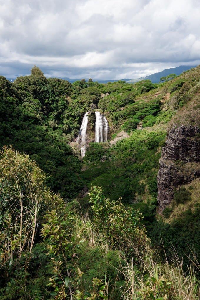 distant waterfalls in a green landscape