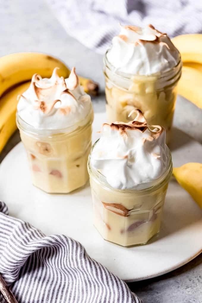An image of three banana puddings with meringue on top.