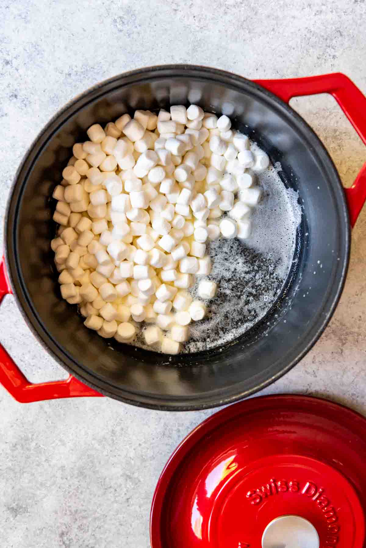 An image of marshmallows and butter in a heavy pan for making marshmallow popcorn balls.