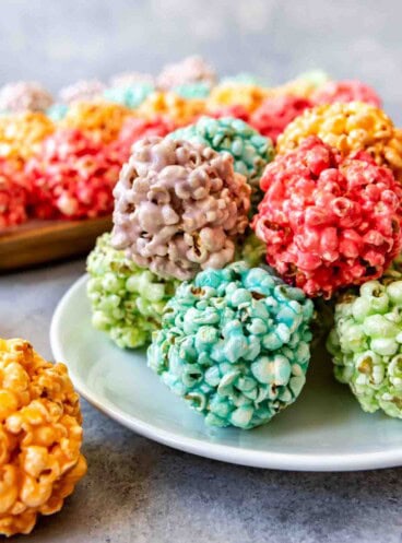 An image of colorful marshmallow popcorn balls made with Jello.