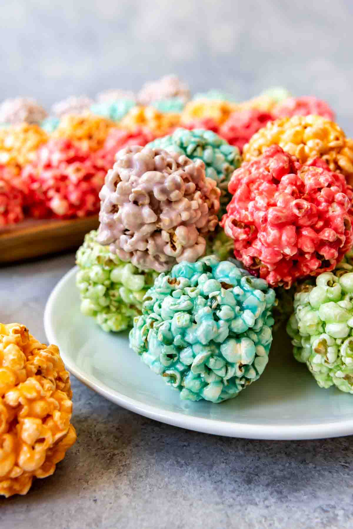 An image of colorful marshmallow popcorn balls made with Jello.