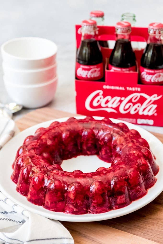 Coca-Cola Jello Salad is a jiggly, fruity treat studded with chopped tart cherries and crushed pineapple, with a bit of kick from the Coca-Cola.  It's especially fun made in a jello mold!