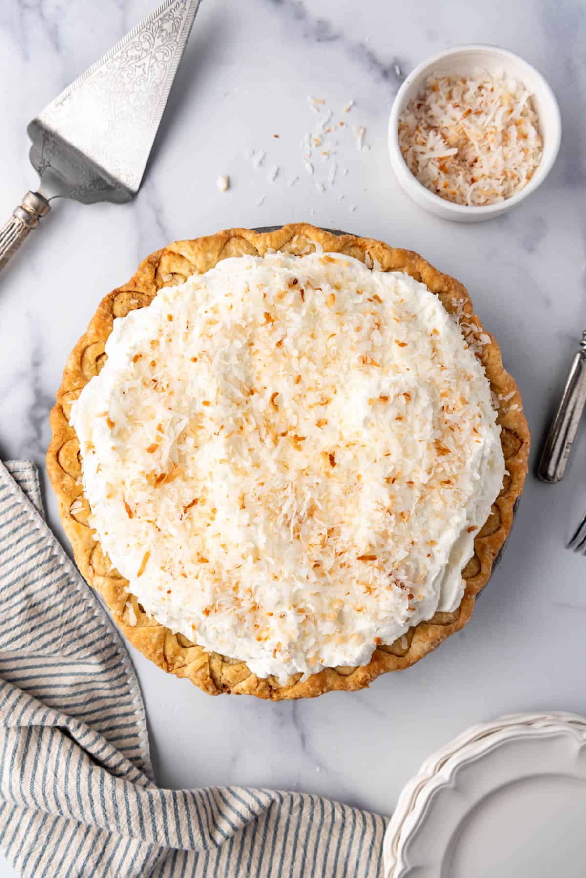 An overhead image of a homemade coconut cream pie.