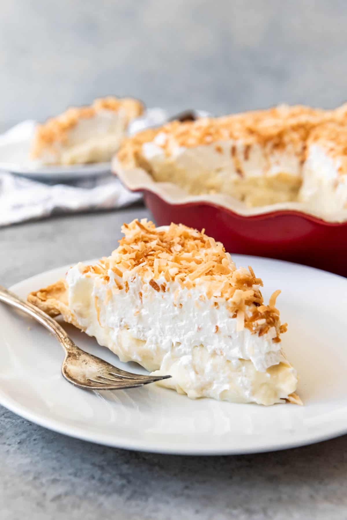 An image of a slice of coconut cream pie made from scratch.