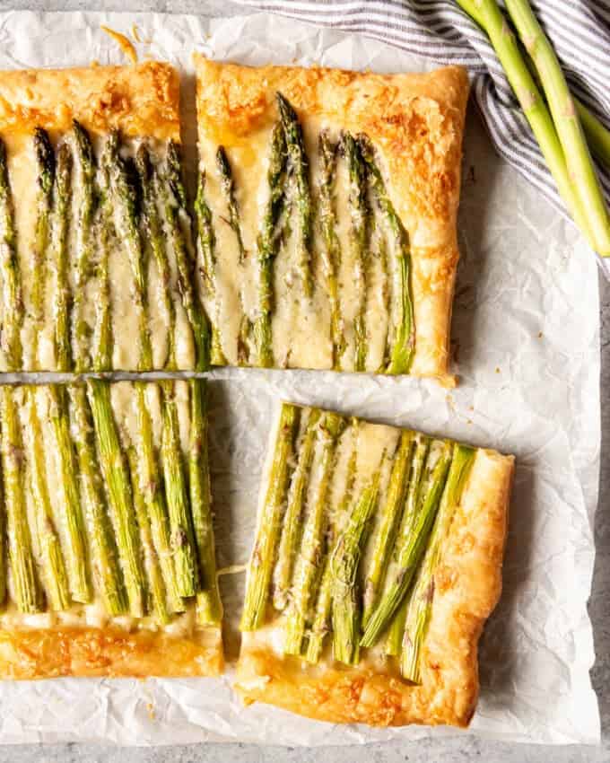 An image of an easy brunch appetizer made with puff pastry, cheese, dijon mustard, and asparagus.