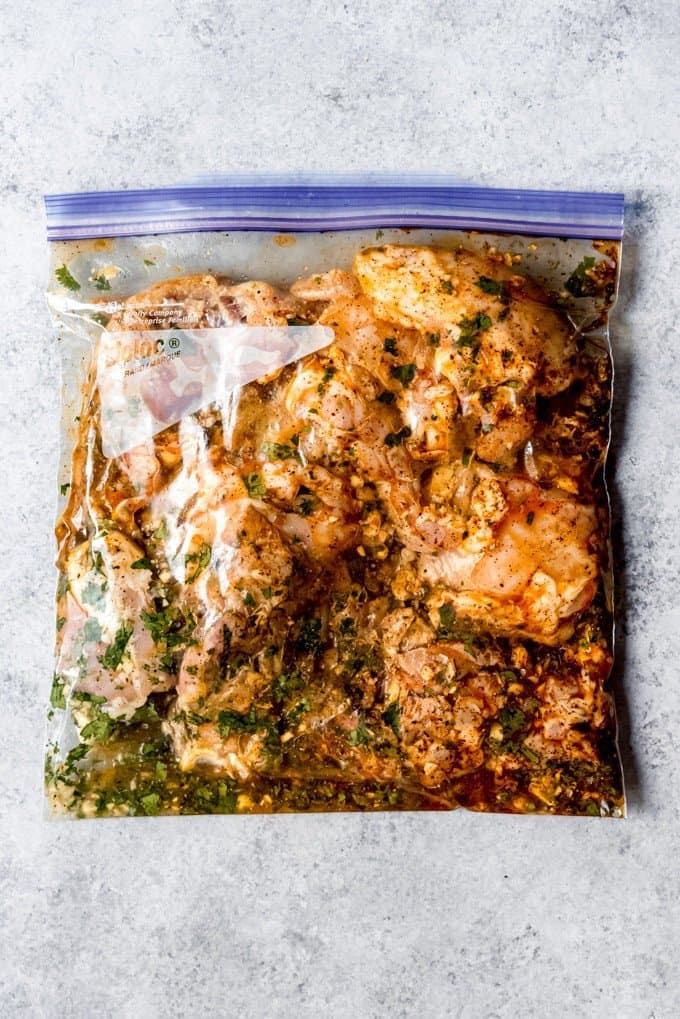 An image of a bag of chicken thighs with a cilantro lime chicken marinade.