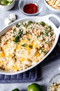 grilled mexican street corn dip in a white casserole dish