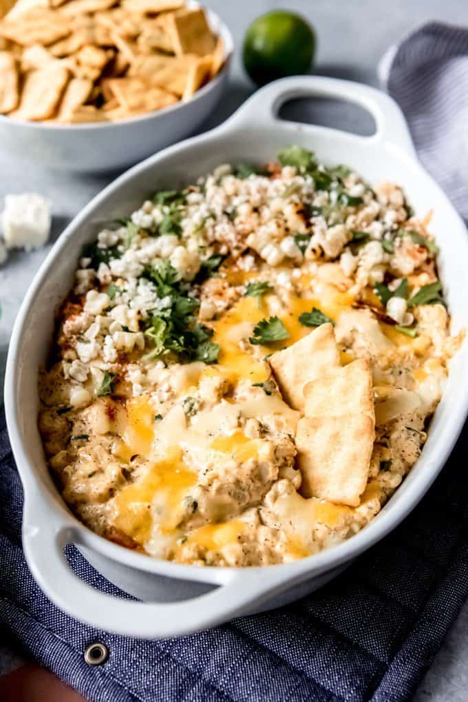 a oval shaped casserole dish filled with Grilled Mexican Street Corn Dip 