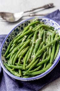 Tender-crisp Haricot Verts (French green beans) with Dijon Vinaigrette are a delicious and easy-fancy side dish that are perfect for serving alongside any holiday meal or Sunday supper.  They can be served warm or cold, making this a great option for picnics and summer barbecues!