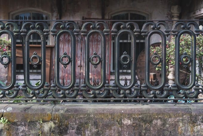 An image of wrought iron and old cement.
