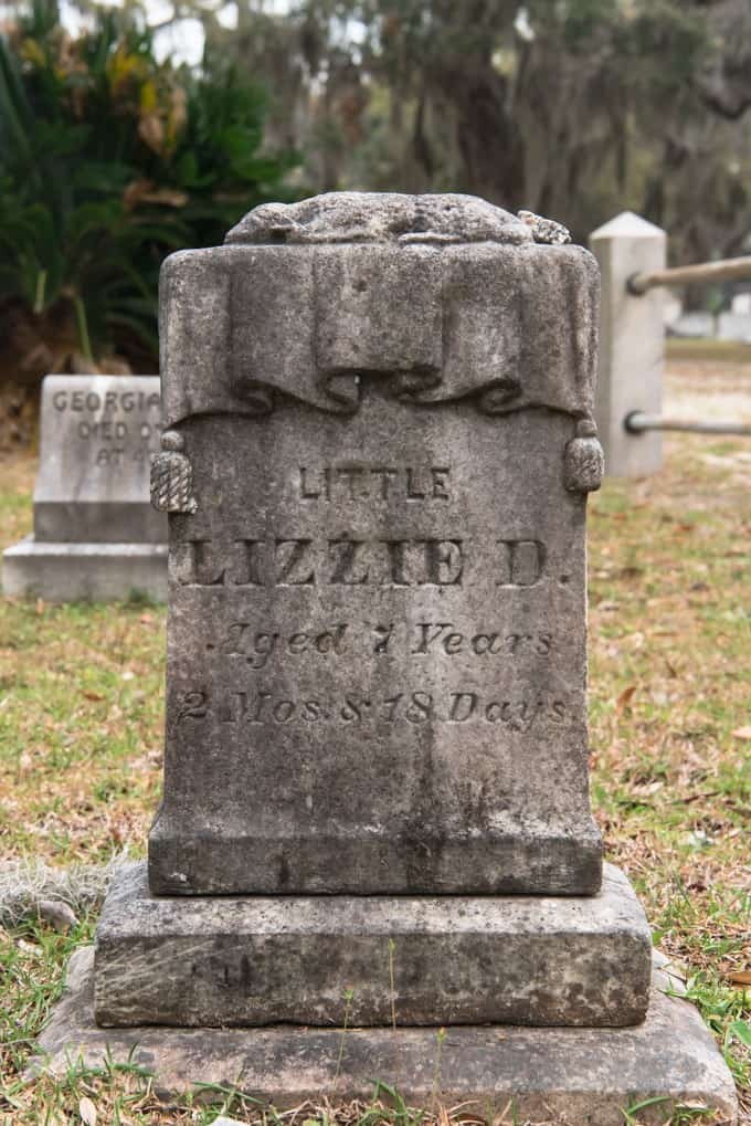 An image of a child's grave marker in Bonaventure Cemetery.