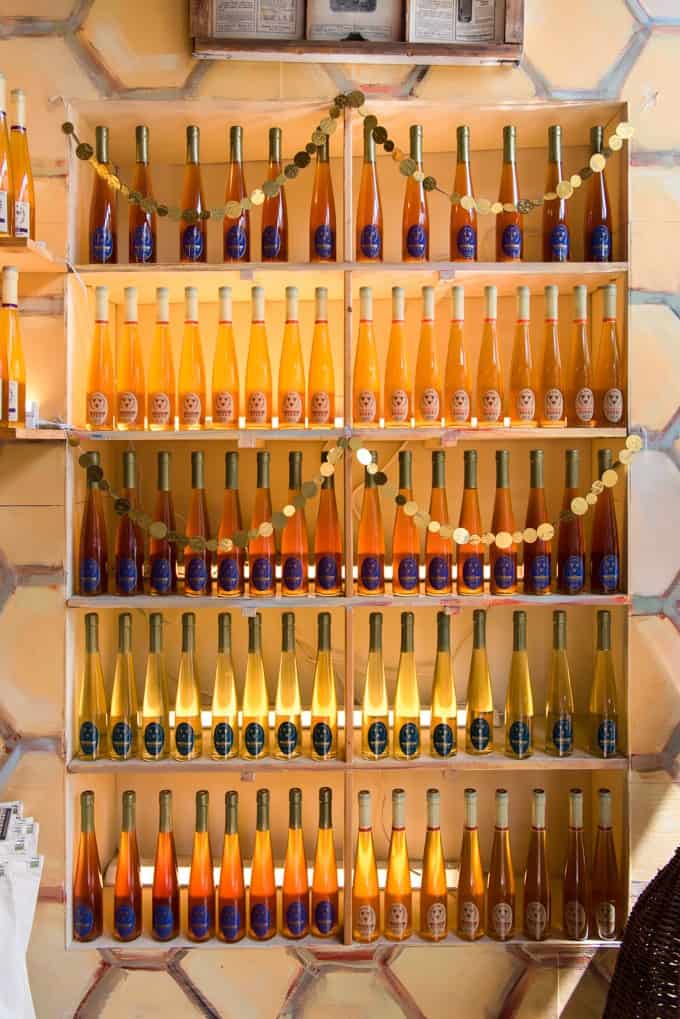 An image of a wall filled with jars of honey at Savannah Bee Company.