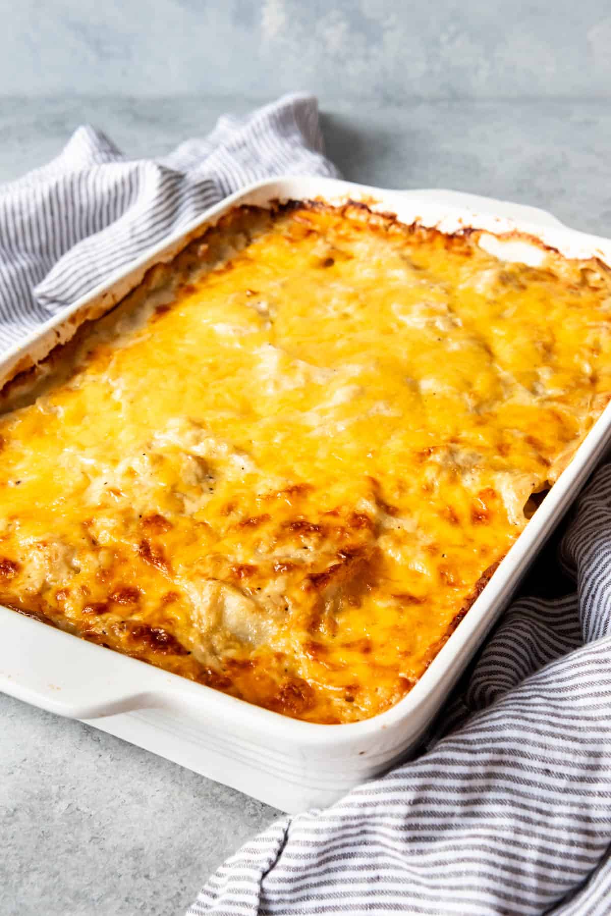 A large pan of au gratin potatoes with a golden brown cheesy crust on top.