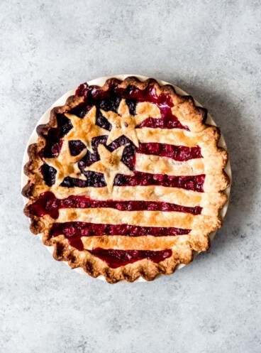 An image of an Old Glory Pie with cherry and blueberry pie fillings and the stars & stripes on top.