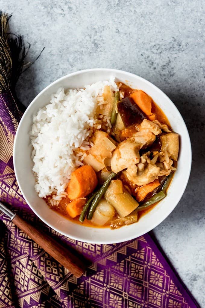 An image of a bowl of Cambodian Chicken Red Curry, known as Somlar Kari Saek Mouan or sometimes Khmer Red Curry.