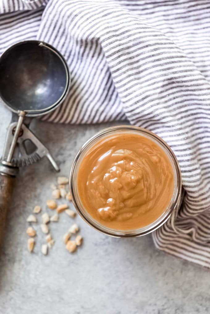 An image of a jar of peanut butter ice cream topping.