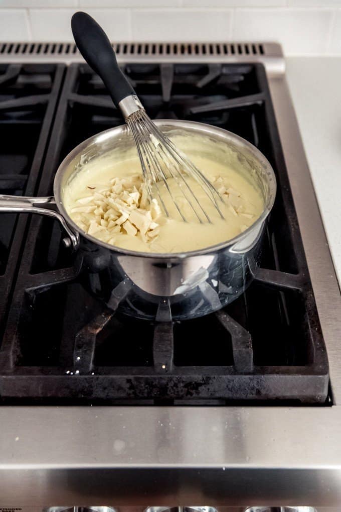 An image of homemade white chocolate pudding made from scratch on the stovetop.