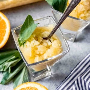 An image of homemade orange granita with basil and coconut flavoring.