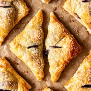 An overhead image of triangle shaped blackberry turnovers.