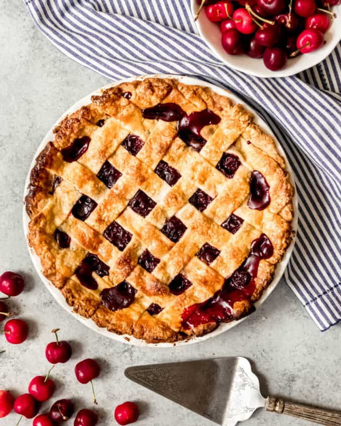 An image of a cherry pie with lattice pie crust on top.
