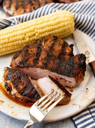 An image of a perfect grilled pork chop with sweet bbq rub.