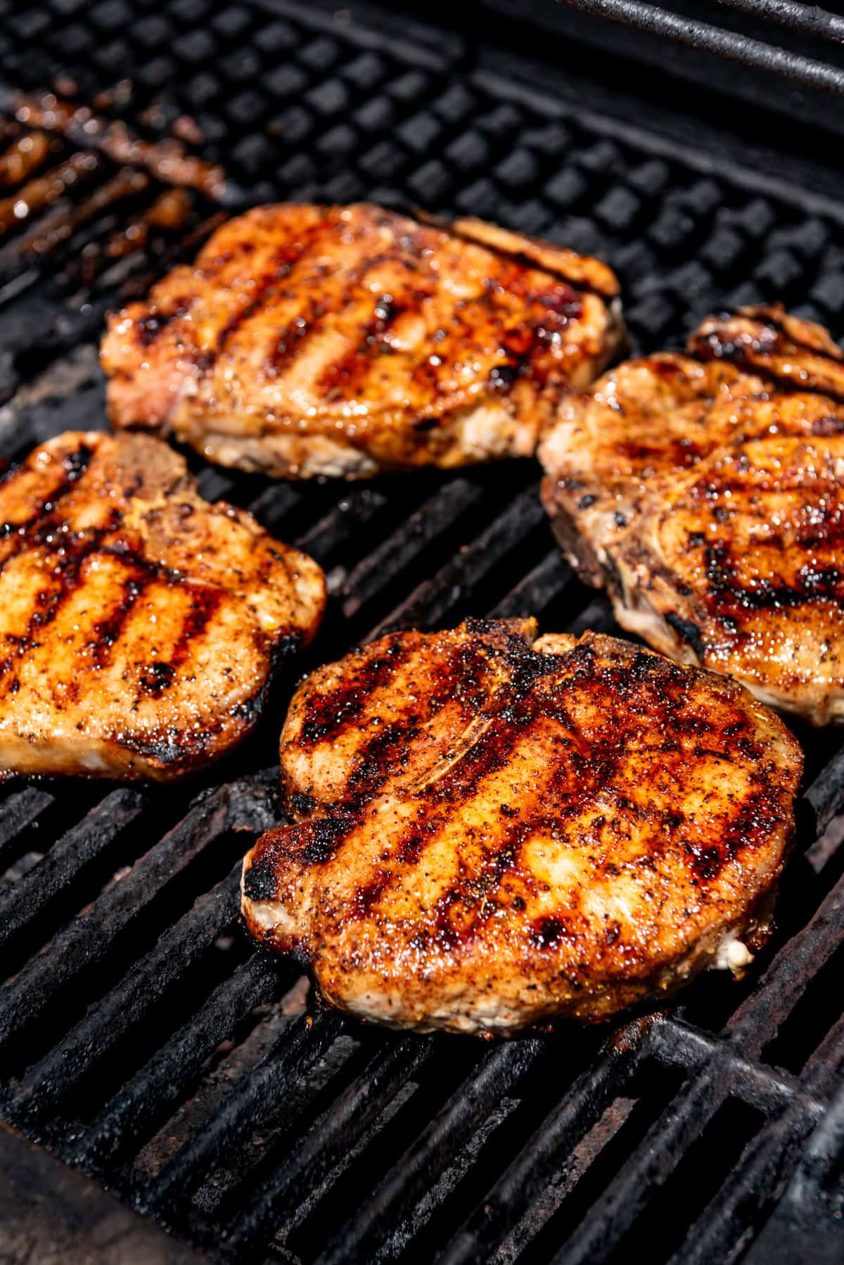 An image of pork chops on the grill.