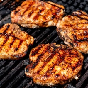 An image of pork chops on the grill.