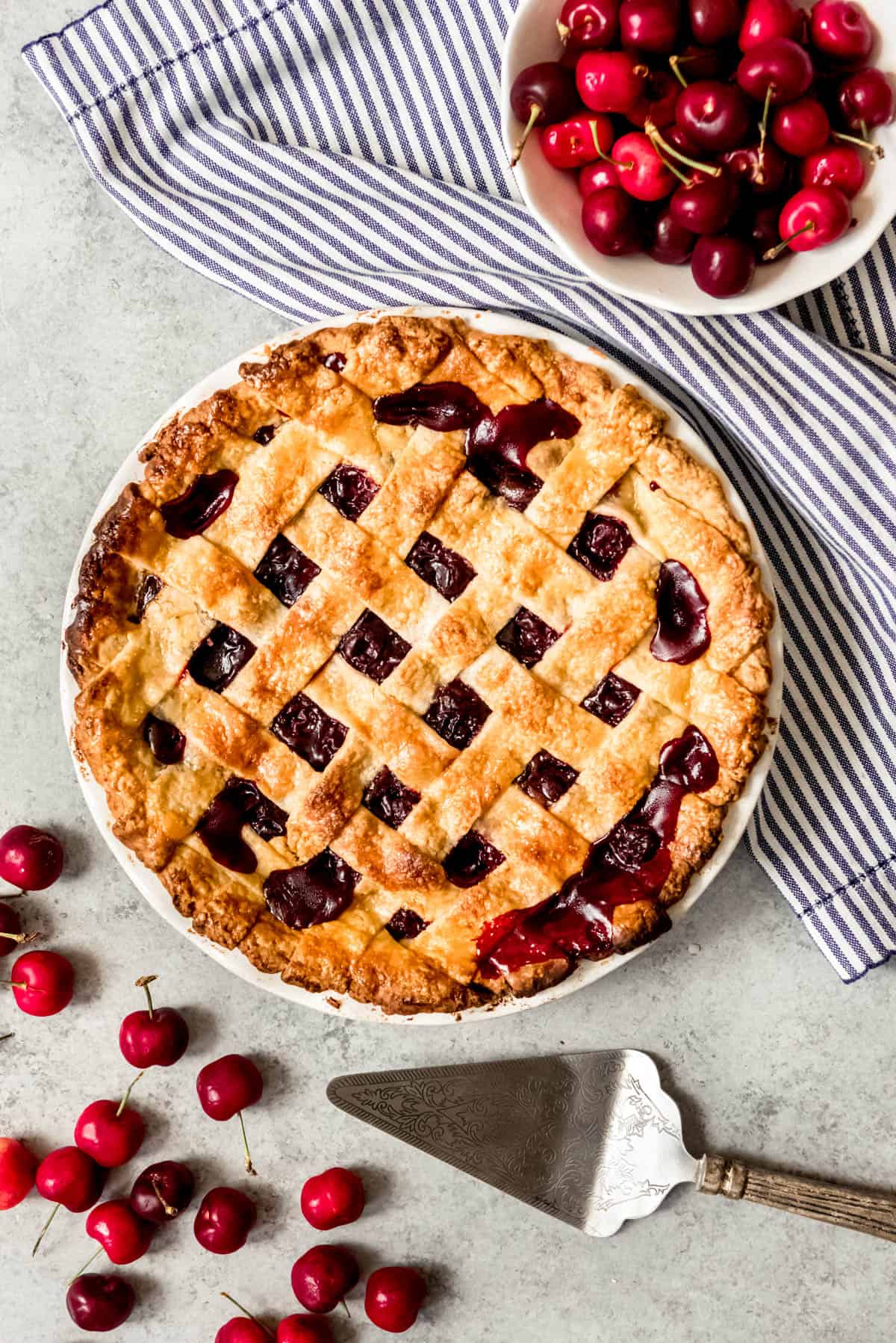 An image of a cherry pie with lattice pie crust on top.