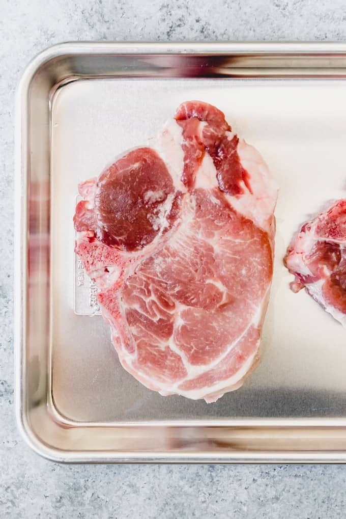 An image of a thick-cut bone-in pork loin chop.