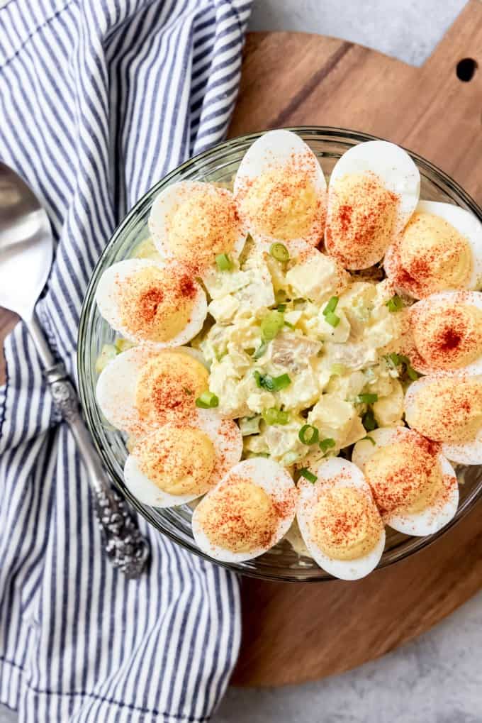 An image of a potluck favorite: old-fashioned potato salad with deviled eggs on top.