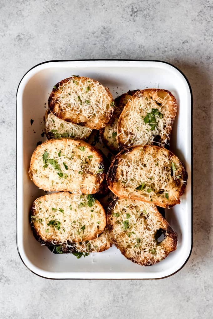 An image of a pan of grilled garlic bread.