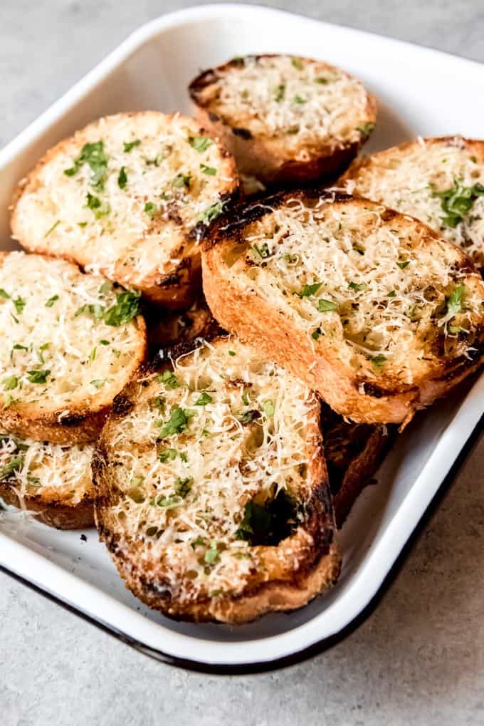 An image of slices of buttery garlic bread toast made on the grill.