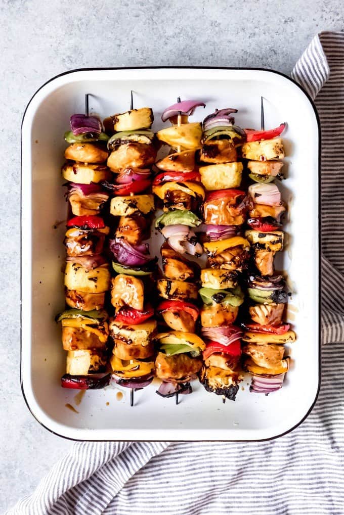 An image of grilled chicken and vegetable skewers that have been brushed with teriyaki sauce after being marinated in teriyaki marinade first.