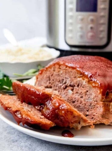 An image of a thick-sliced meatloaf with sweet ketchup glaze made in the instant pot pressure cooker.