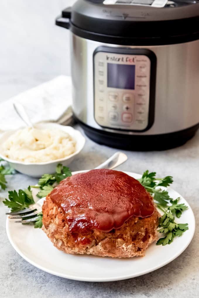 An image of Instant Pot Meatloaf and Mashed Potatoes with sweet ketchup glaze.