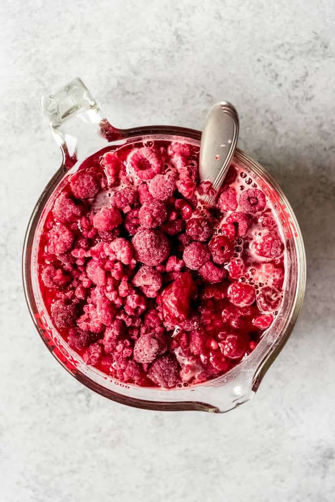 An image of frozen raspberries in jello.