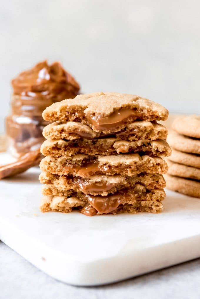 A stack of dulce de leche stuffed cookies.